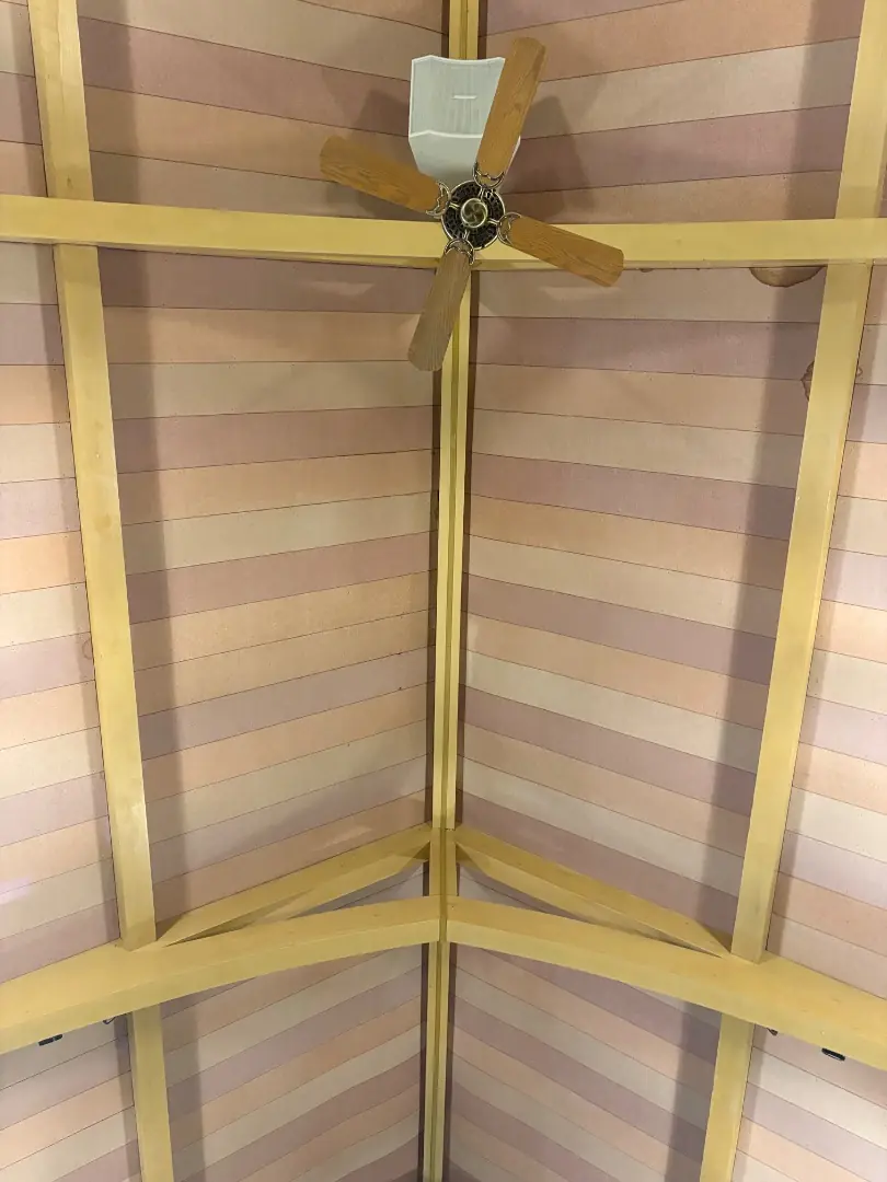 Final walkthrough of the restored vaulted ceiling and ceiling fan inside the church