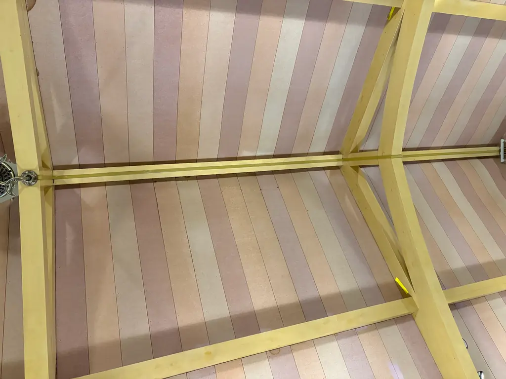 Close-up of the church rafters after mold removal and repainting