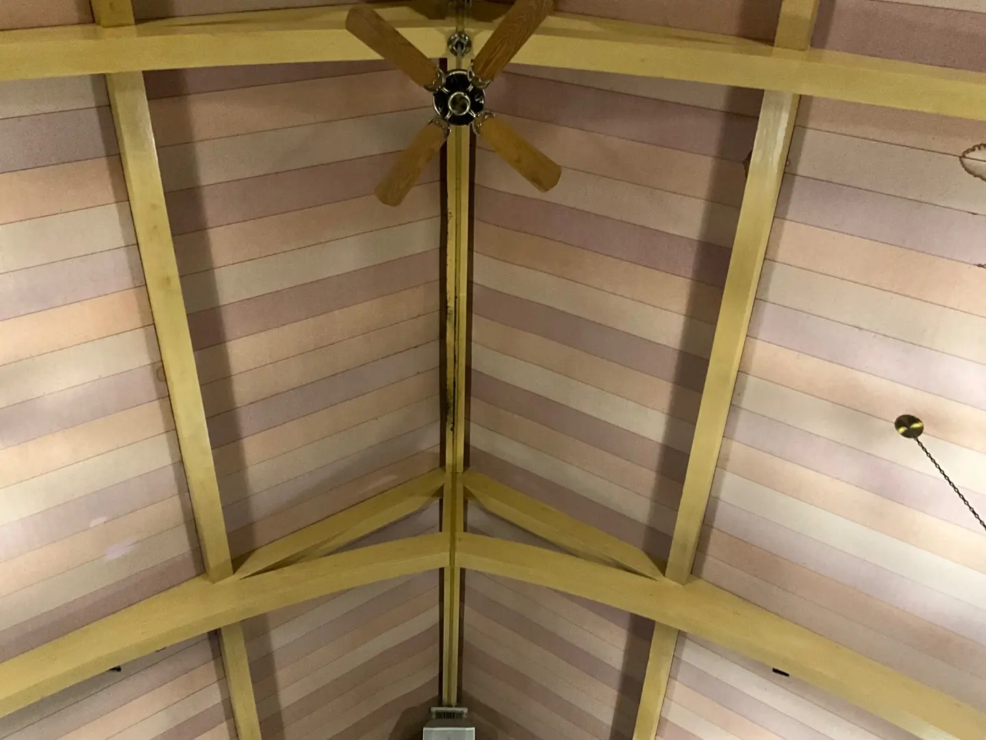 Restored vaulted ceiling and rafters inside SUMC Church after mold remediation